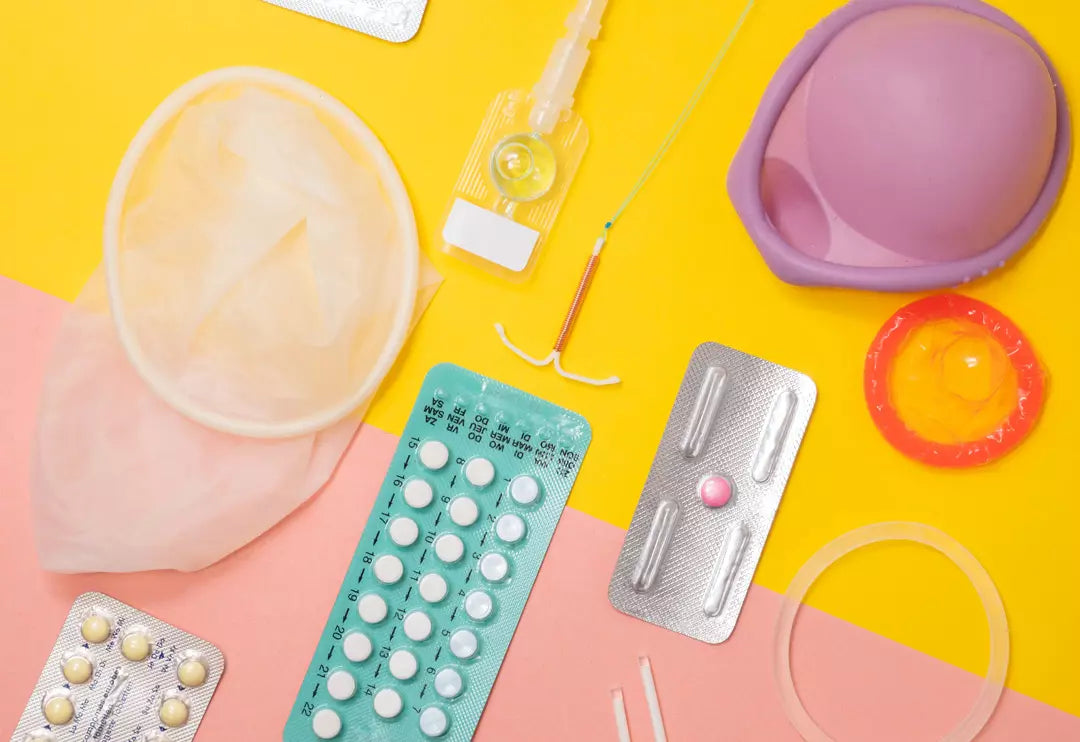 Birth control methods laid out on a yellow and pink background.