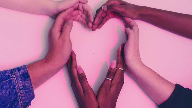 Hands forming the shape of a heart.