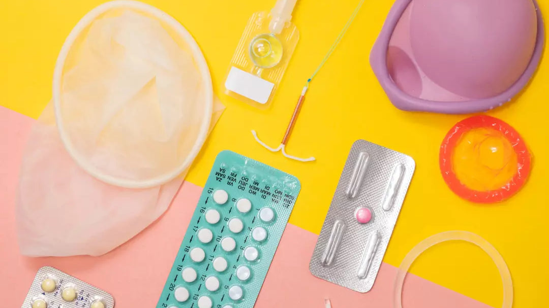 Birth control methods laid out on a yellow and pink background.
