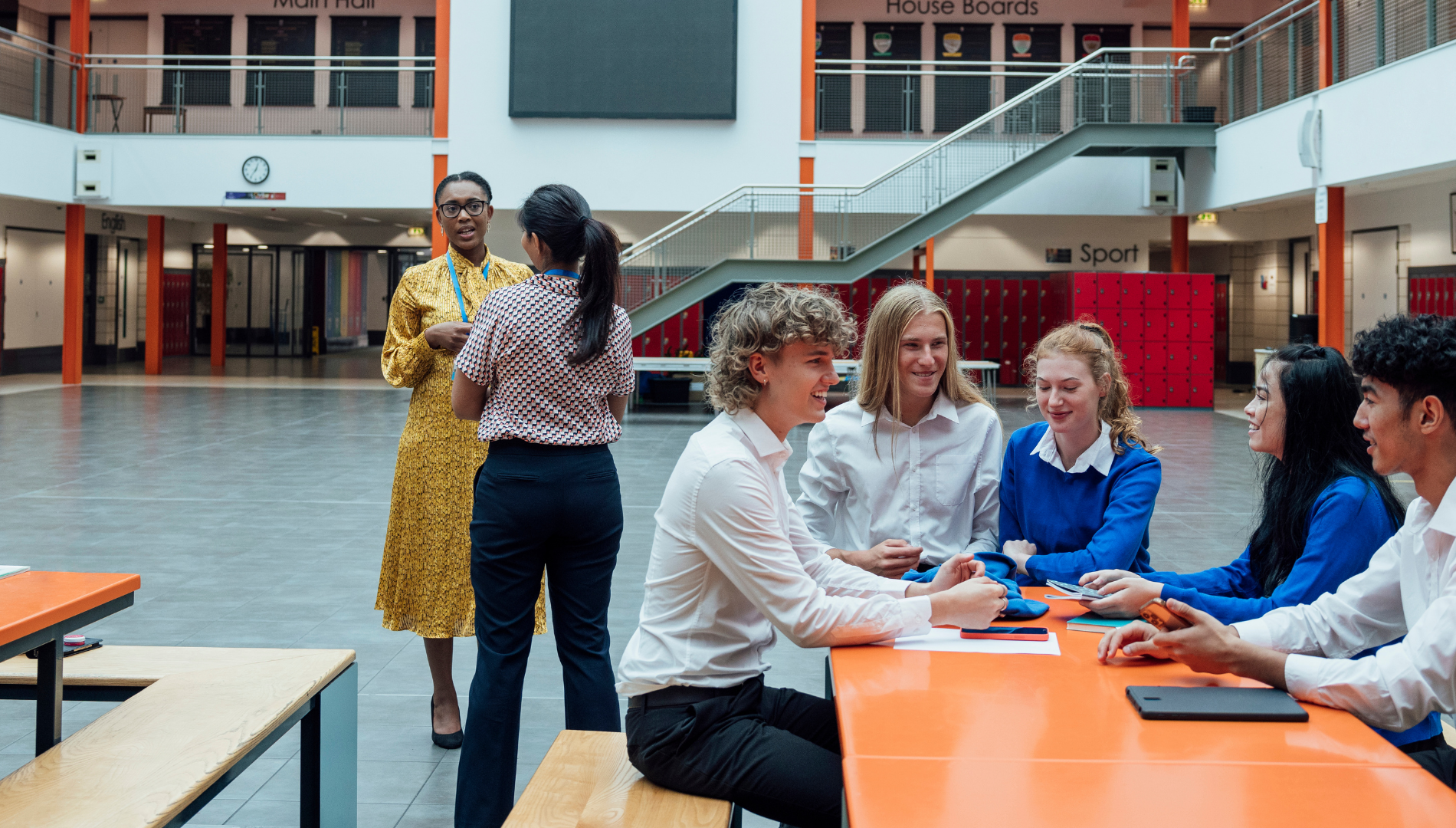 A diverse group of professionals in a meeting room, representing an inclusive, period-conscious workplace environment