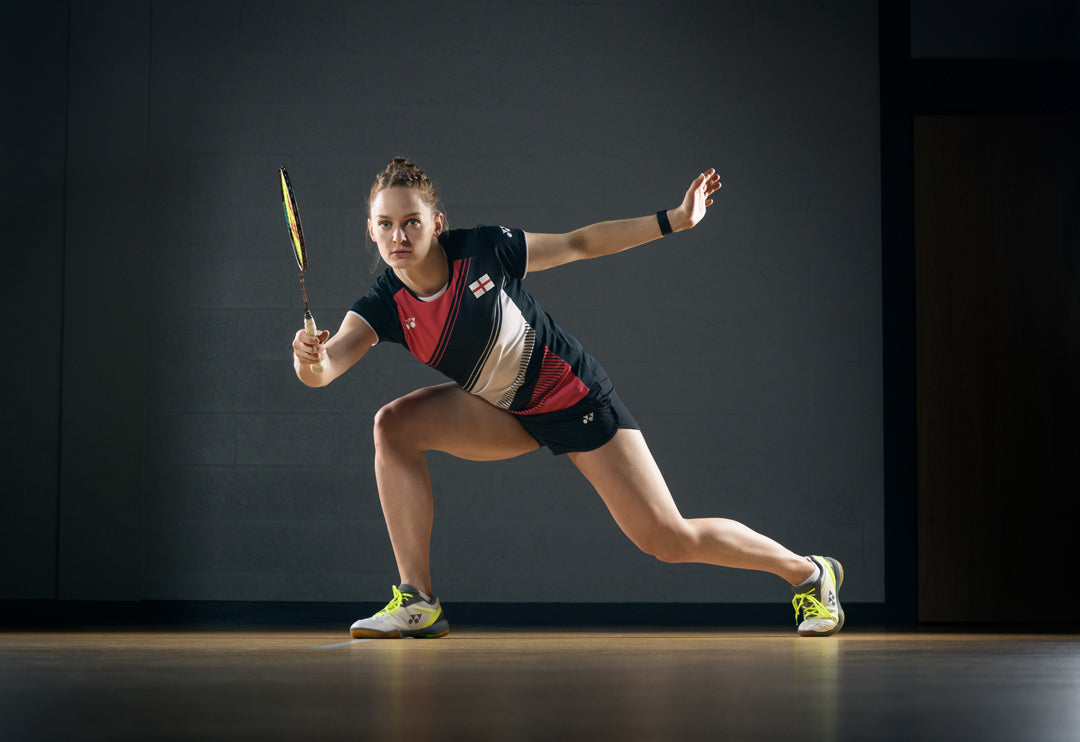 Olympian Lauren Smith posing with her badminton racket.