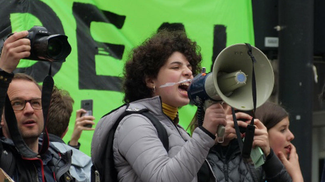 Activist shouting into a microphone.