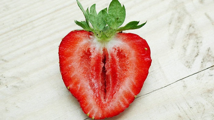 A strawberry cut in half.