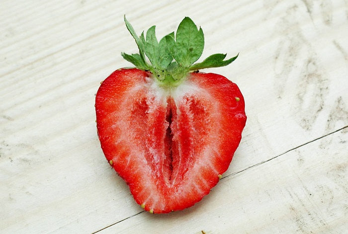 A strawberry cut in half.