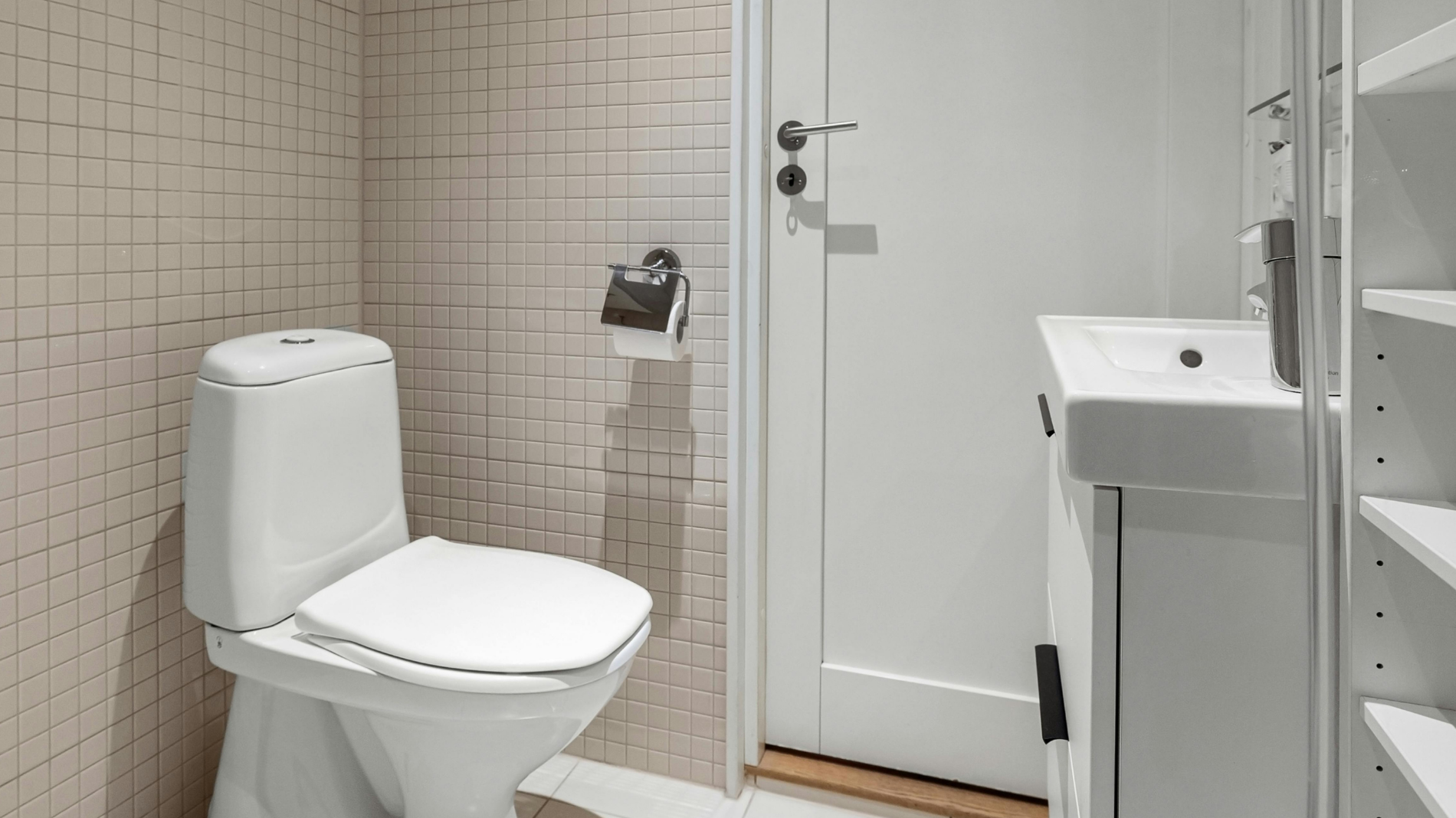 Clean white toilet in a bathroom — supporting blog about what to do if you drop your menstrual cup in the toilet and how to safely sterilise it for reuse