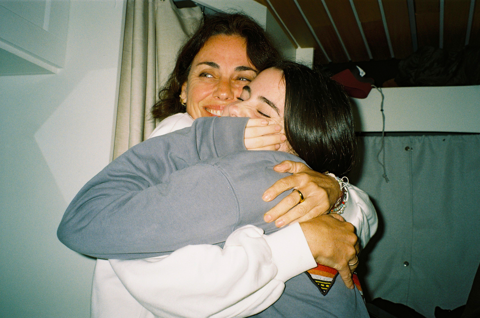 teen and mum hugging