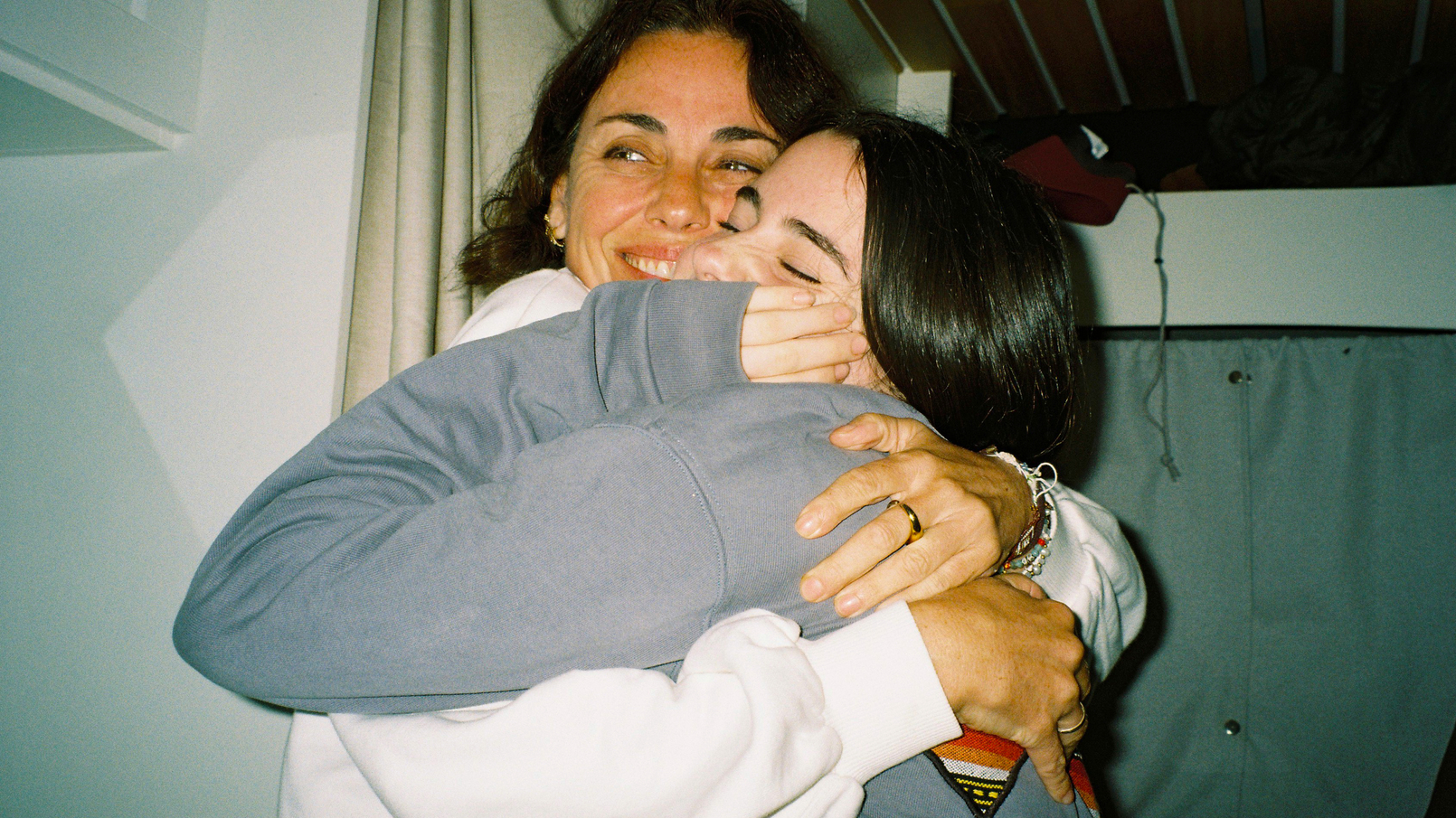 teen and mum hugging